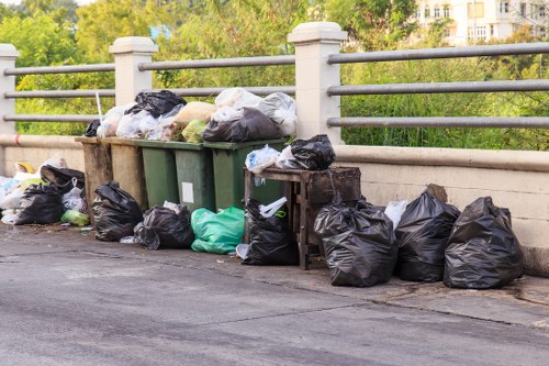 Crew finishing a clearance and sorting items for recycling